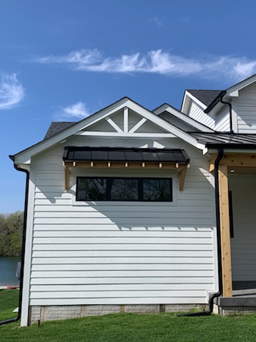 A finished residential roofing project showcasing a beautiful roof
