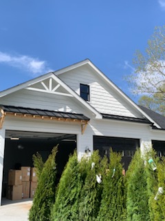 A completed roof installation with perfectly aligned roofing tiles