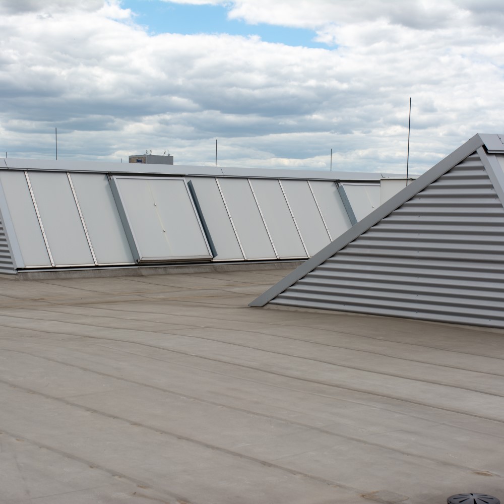A sleek, modern building completed by commercial roofing near me.